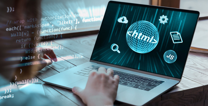 Web developer at desk with code icons